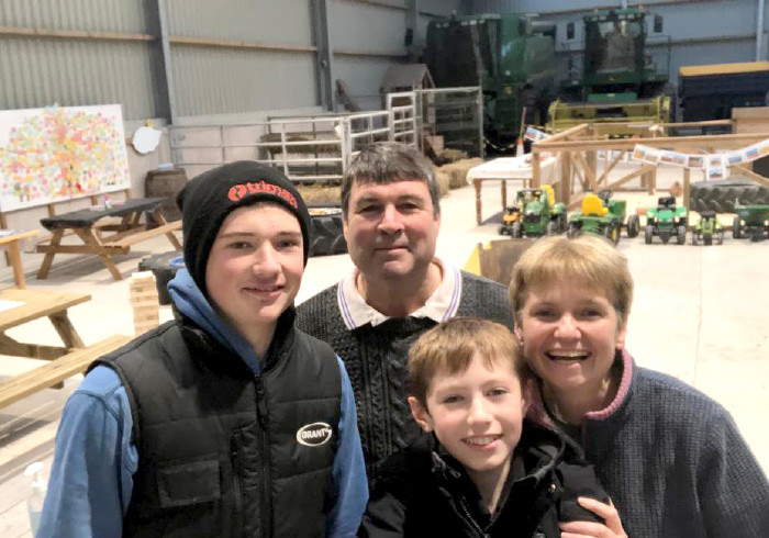 The Currie family in the barn
